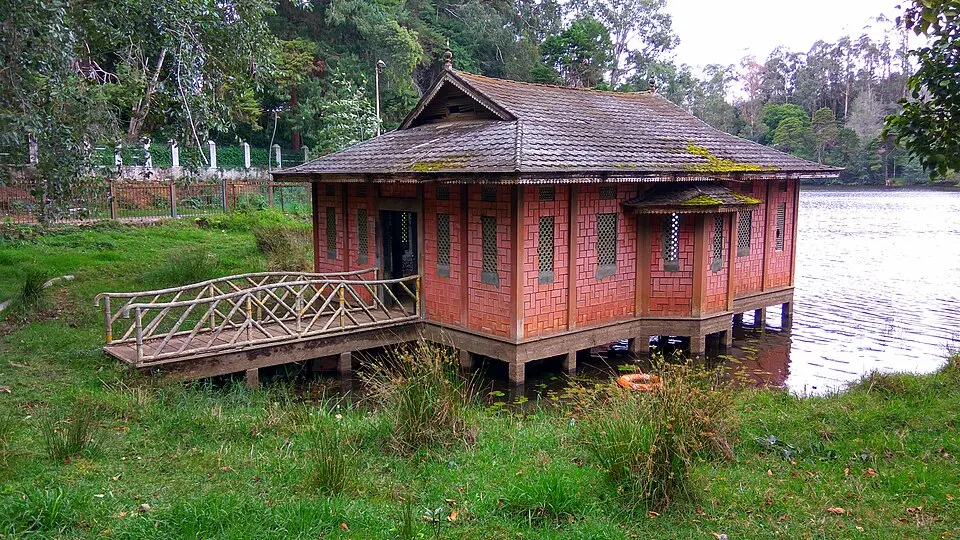  Sunset at Berijam Lake boathouse surrounded by shola forest, Kodaikanal