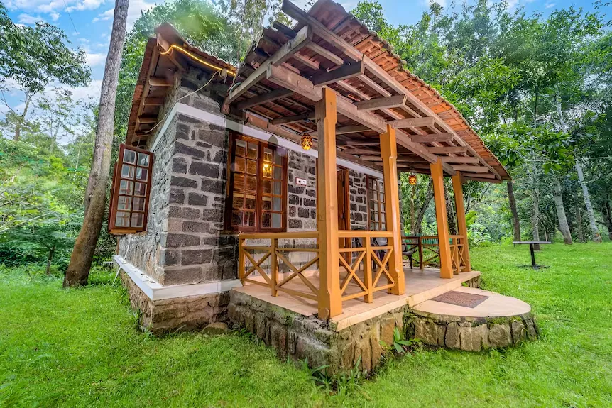 Exterior of an eco-material luxury cottage with valley view at Zacs Valley Resort, Kodaikanal