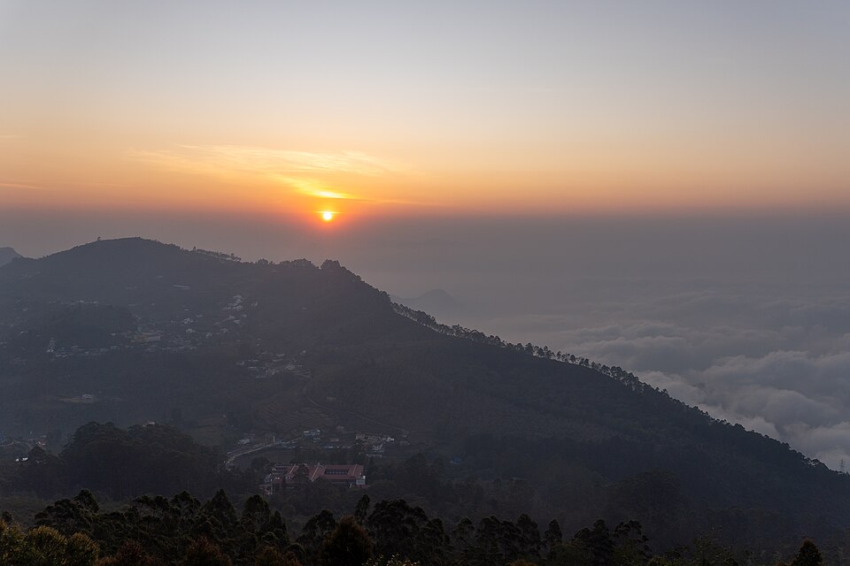 Early morning mist and golden light over Pambar Valley from Coaker's Walk, Kodaikanal