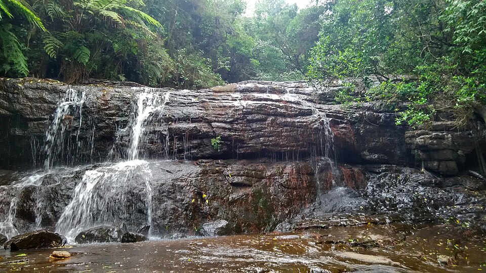 Fairy Falls cascading through mossy rocks in Kodaikanal