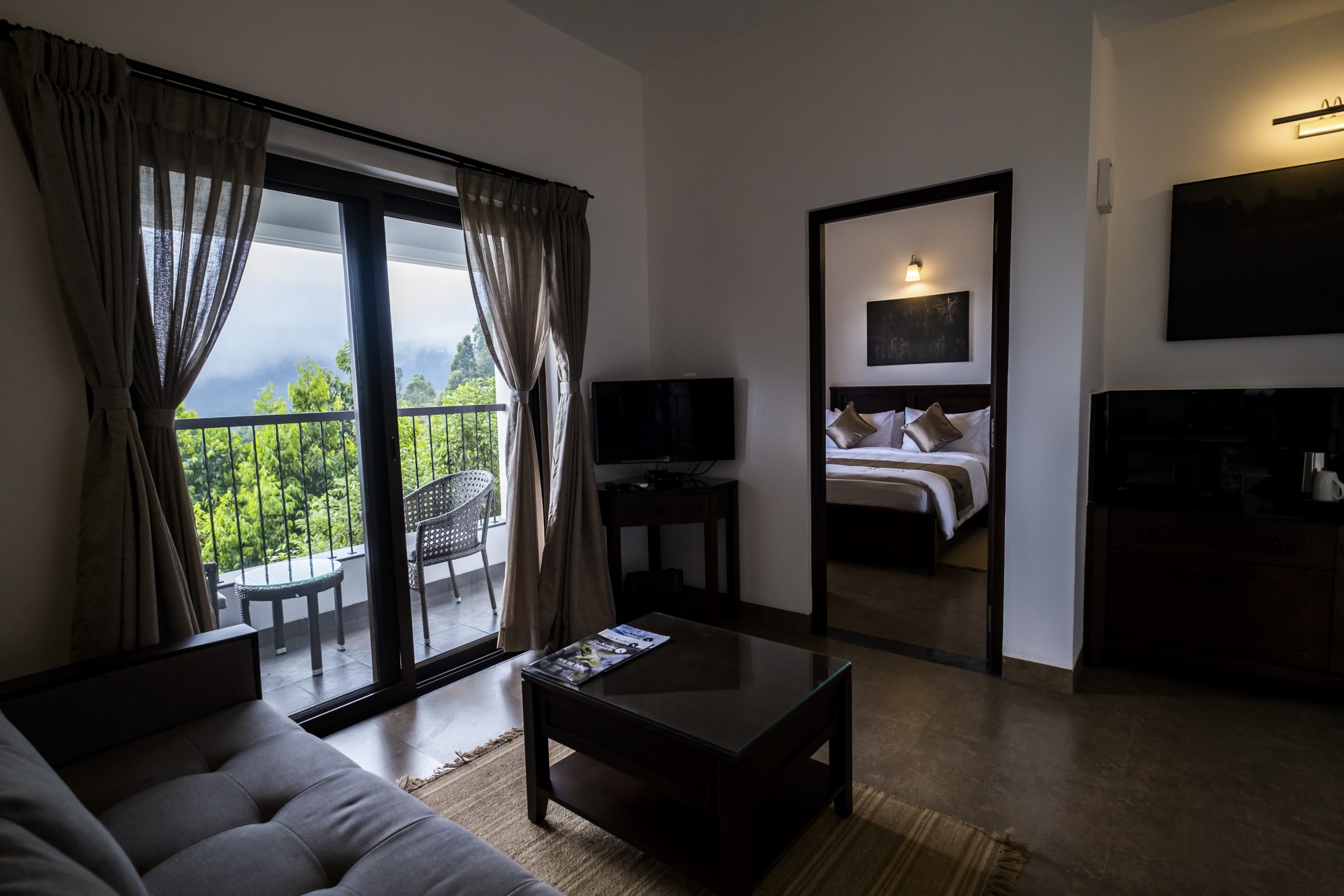 Elegant interior of a cottage room at DVARA Kodaikanal with colonial-style furnishings