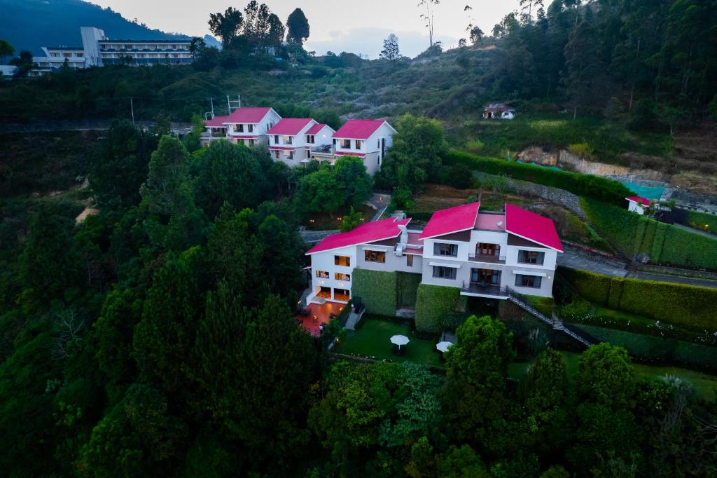 Colonial bungalow exterior of DVARA Kodaikanal boutique resort surrounded by pine trees, Vilpatti